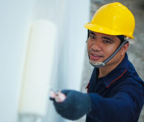 Asian,Painter,Is,Painting,White,House,Wall,,House,Decoration,And